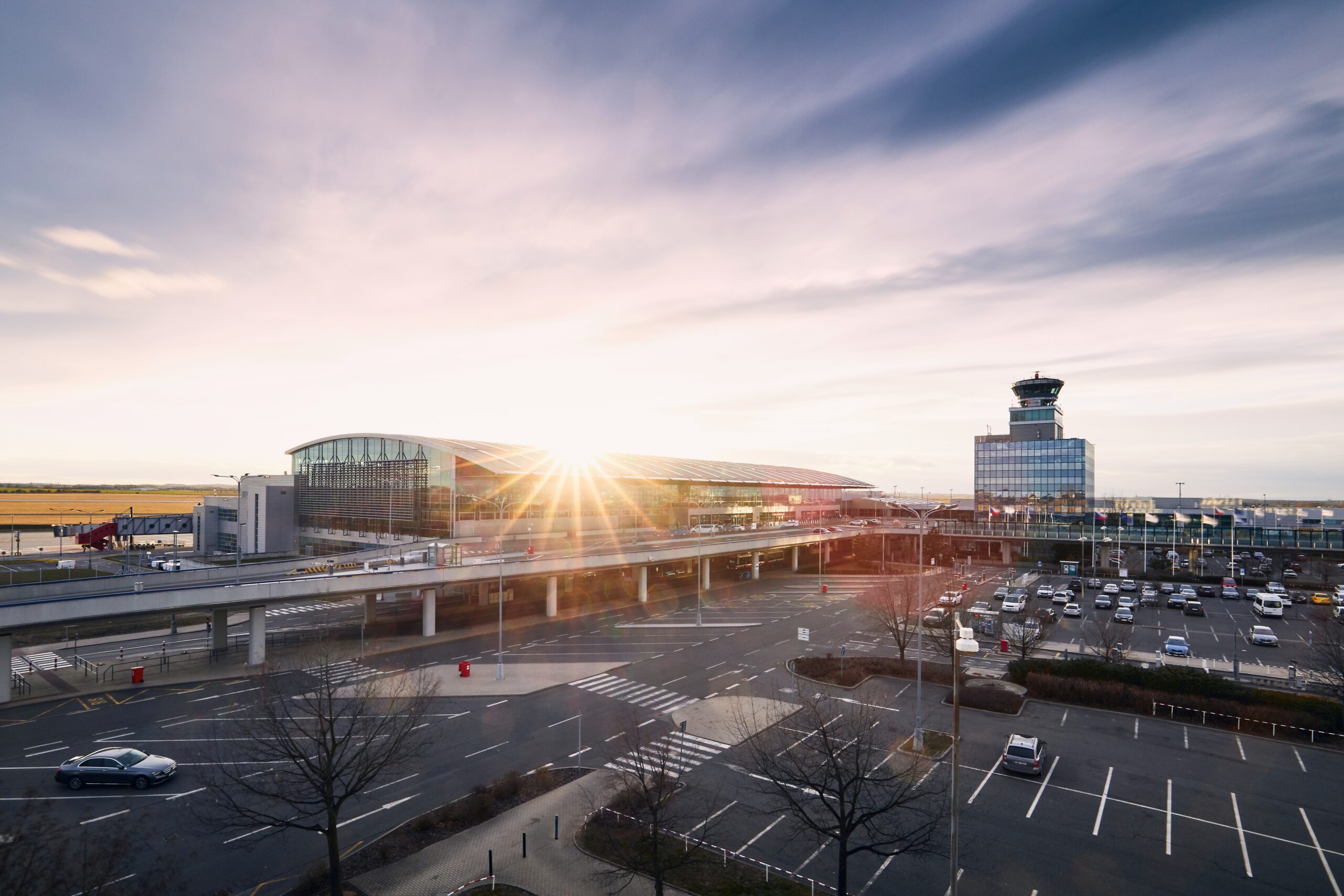 Prague, Czech Republic - March 13, 2019: Terminal building and air traffic control tower at Vaclav Havel Airport Prague on March 13, 2019.